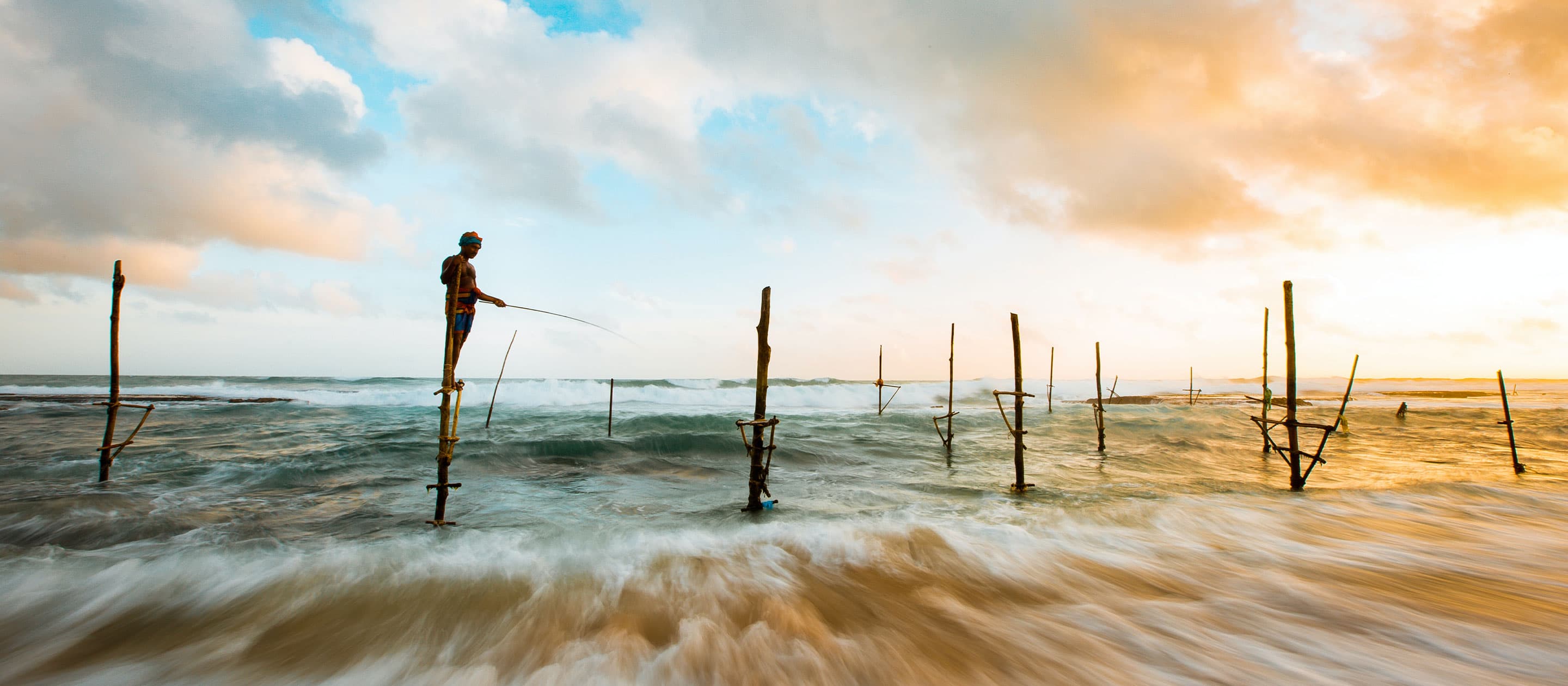 Iconic stilt fishermans in Hikkaduwa, Sri Lanka.